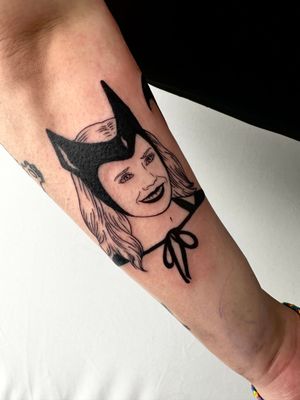 Discover the intriguing beauty of blackwork with this forearm tattoo featuring a woman and mask design by Miss Vampira.