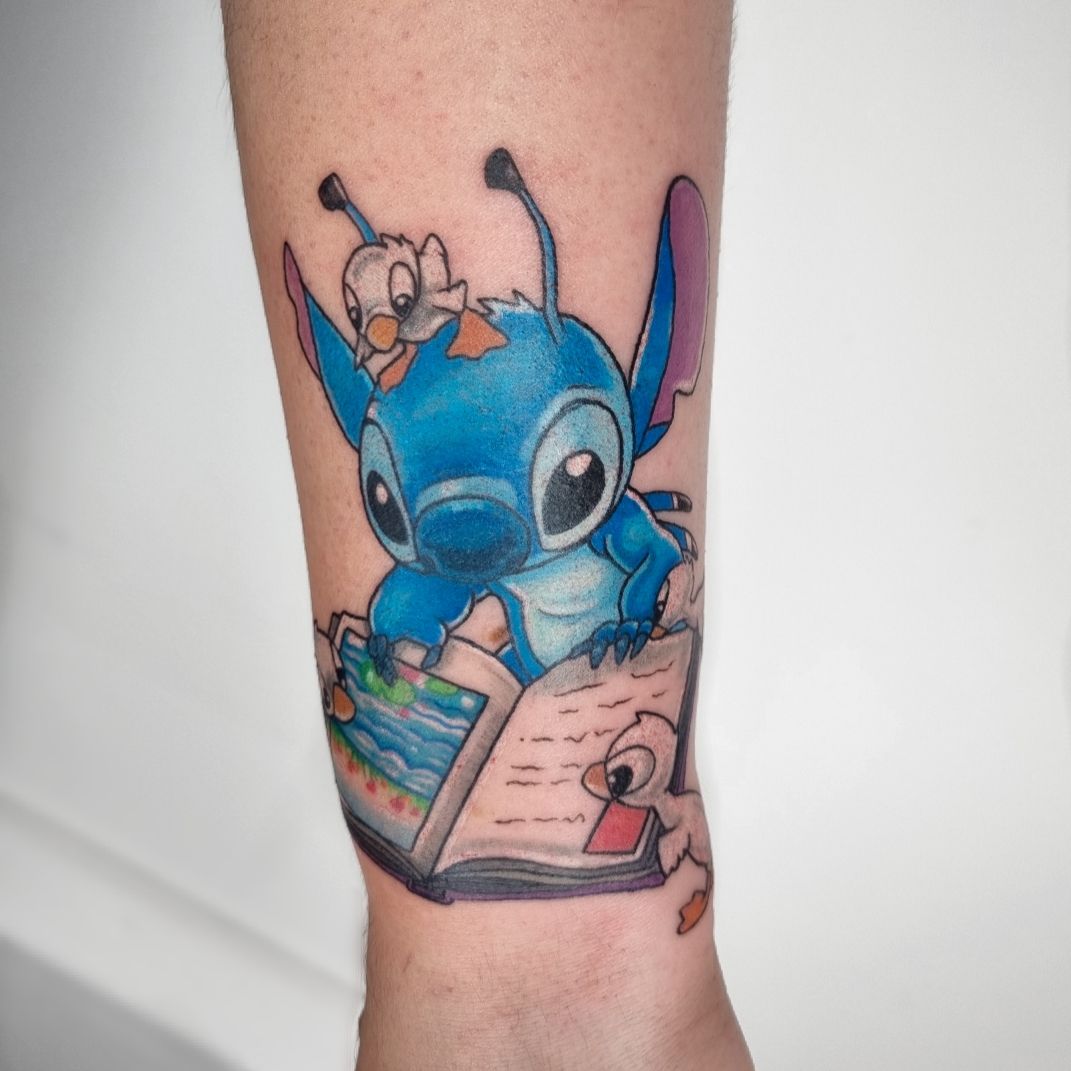 Stitch Character Inspired Tattoo With Vivd Watercolors And Calligraphy –  Starry Eyed Tattoos and Body Art Studio