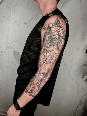 Capture the beauty of realism with this black and gray sleeve tattoo featuring a man and architectural elements. By talented artist Jones.