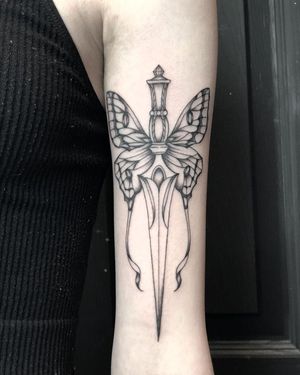 Fine Line Butterfly and Dagger Tattoo done at Hammersmith Tattoo London