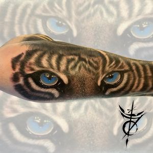 Blue Tiger Eyes Black & Grey Realism Tattoo done at Hammersmith Tattoo London