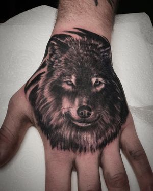 Wolf on hand Black & Grey Realism Tattoo done at Hammersmith Tattoo London