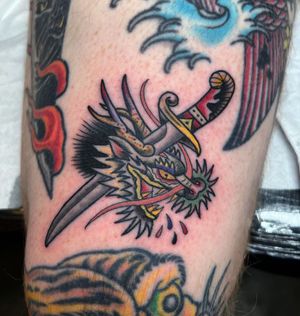 Traditional Dragon and Dagger Tattoo done at Hammersmith Tattoo London