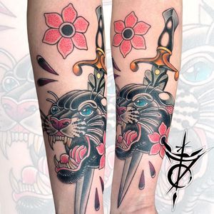 Puma and Dagger with Flowers Neo Traditional Tattoo done at Hammersmith Tattoo London