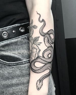 Fine Line Snake Tattoo done at Hammersmith Tattoo London