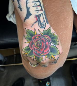Traditional Rose on hand Tattoo done at Hammersmith Tattoo London