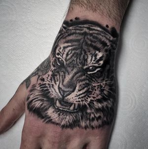 Tiger Hand Black & Grey Realism Tattoo done at Hammersmith Tattoo London