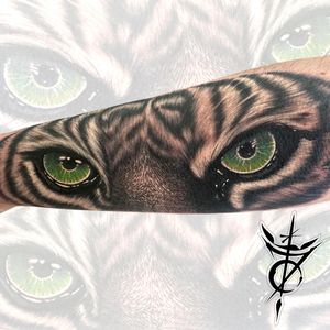 Green Tiger Eyes Black & Grey Realism Tattoo done at Hammersmith Tattoo London