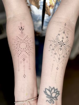 Get a stunning hand-poke mandala design by Indigo Forever Tattoos for a unique, ornamental look on your forearm.