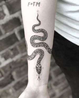 Fine Line Snake Tattoo done at Hammersmith Tattoo London