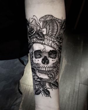 Realism Skull and Snake Tattoo done at Hammersmith Tattoo London