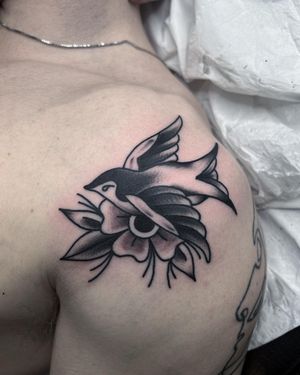 Swallow and Flower Traditional Tattoo done at Hammersmith Tattoo London
