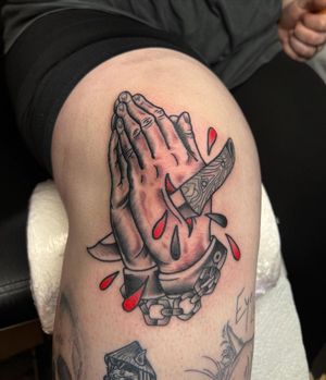 Praying Hands and Dagger Traditional Tattoo done at Hammersmith Tattoo London