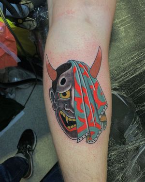 Experience the traditional artistry of a Japanese hannya tattoo by Andrea Furci, beautifully inked on your lower leg.