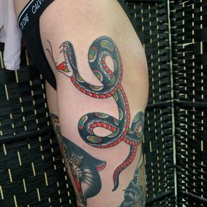 Get a traditional Japanese snake tattoo on your upper leg by the talented artist Andrea Furci. Embrace the power and beauty of this iconic motif.