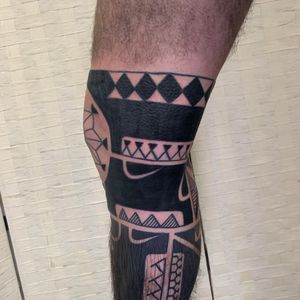Elegant ornamental blackwork pattern tattoo on the knee by Andrea Furci. Unique and intricate design.