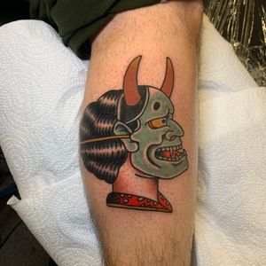 Experience the fierce beauty of a traditional Japanese Hannya mask tattoo on your lower leg by renowned artist Andrea Furci.