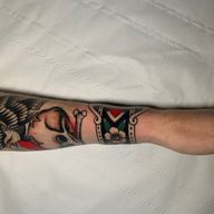 Explore the beauty of blooms with this stunning traditional style forearm tattoo by Andrea Furci.