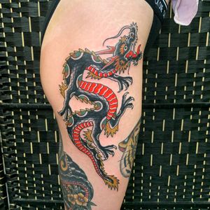 Get a stunning Japanese dragon tattoo on your upper leg by the talented artist Andrea Furci. Embrace the mystique and power of this mythical creature.