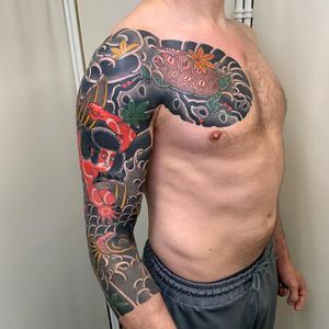 Get a stunning sleeve tattoo featuring a majestic turtle and fierce samurai designed by the talented artist Andrea Furci.