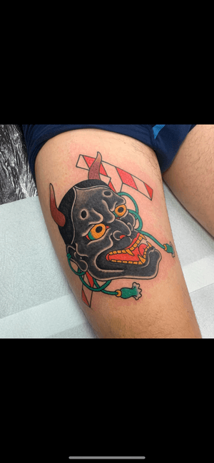 Capture the fierce and captivating beauty of a traditional Japanese hannya mask with this intricate tattoo on the upper leg, expertly done by artist Andrea Furci.