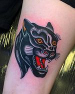 Get inked with a fierce traditional panther design by renowned artist Andrea Furci. Stand out with this timeless piece on your arm.