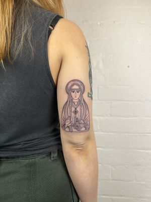 Elegant black and gray fine line tattoo of a mysterious woman by a church on upper arm. Detailed and refined artwork by the talented artist Jack Henry.