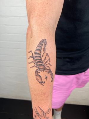 Get a stunning black & gray scorpion tattoo on your forearm by Jack Henry Tattoo. This fine line traditional design is perfect for all Scorpio zodiac signs.