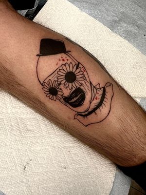 Unique lower leg tattoo featuring artful clown design by Miss Vampira.