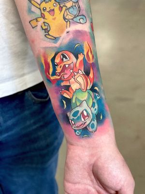 Vibrant new school style tattoo featuring Pikachu and Charizard by skilled artist Artemis. Perfect for Pokemon fans!