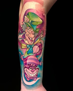 Vibrant new school forearm tattoo by the talented Artemis featuring two iconic characters from Alice in Wonderland.