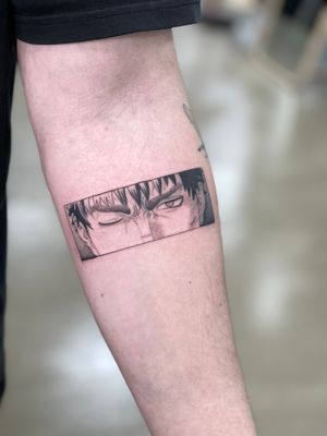Express your inner anime hero with this bold blackwork forearm tattoo of a man, artistically crafted by Artemis.