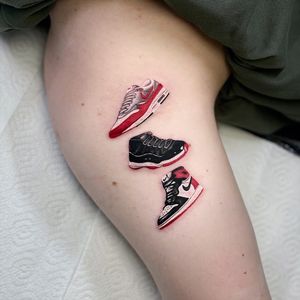 Capture the essence of your favorite kicks with a stunning realism tattoo by Artemis. Show off your love for sneakers in style.