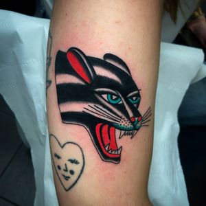 Get fierce with this traditional panther tattoo on your forearm, done by the talented artist Ryan Goodrum.