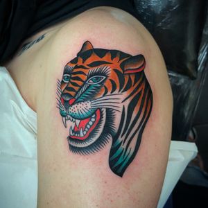 Unique and powerful tiger design in neo traditional style, expertly executed on the upper arm by tattoo artist Ryan Goodrum.