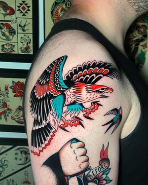 Capture the strength and independence of the eagle with this traditional style upper arm tattoo by artist Ryan Goodrum.