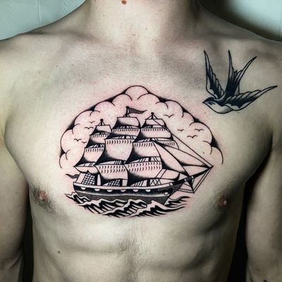 Capture the power of the sea with this classic black and gray tattoo by tattoo artist Ryan Goodrum. Perfect for those who love nautical themes.