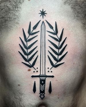 Adrimetric showcases intricate illustrative style with a sword and branch motif in this striking blackwork tattoo design.