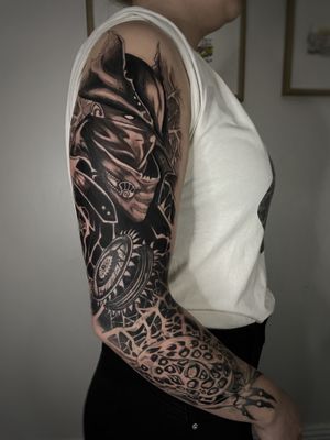 Express your unique style with an anime-inspired blackwork sleeve tattoo featuring intricate patterns and a mysterious mask motif by renowned artist Kike Krebs.