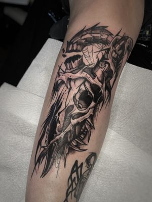 Intricate black and gray skull design for a bold and edgy lower leg tattoo by talented artist Kike Krebs.