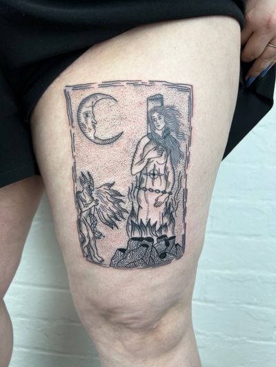 Indulge in the dark allure of devilish beauty with this haunting black & gray tattoo by Jack Henry, featuring a fiery woman motif on your upper leg.