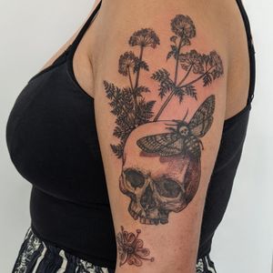 Get a unique hand-poked and dotwork illustration of a moth and skull by the talented artists at Alien Ink. Stand out with this dark and intricate design.