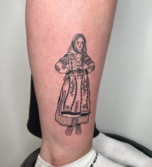 Elegant dotwork and fine line lower leg tattoo featuring a traditional woman in a stunning ornamental dress. By Jack Henry Tattoo.