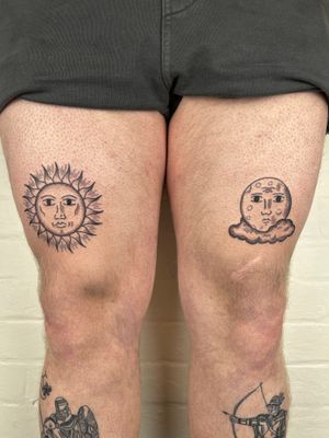 Elegant black and gray fine line tattoo featuring a sun, moon, and cloud motif on the upper leg.