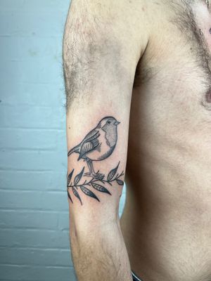 Elegant black and gray tattoo blending bird, leaf, and wings motifs in dotwork and fine line style by Jack Henry Tattoo.