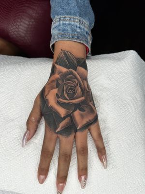 Rose tattoo on the hand 