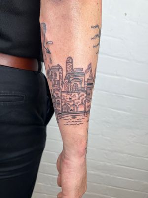 Elegant black and gray forearm tattoo featuring intricate architecture by Jack Henry Tattoo.