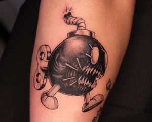 Get ready for the ticking time bomb on your shin by artist José. This edgy black and gray new school design will make a bold statement.
