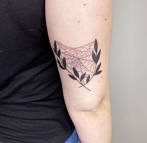 Unique design combining spider and leaf motifs, in fine line style by Rachel Angharad. Perfect for upper arm placement.