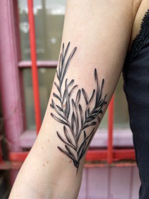 Exquisite black and gray upper arm tattoo of delicate leaves by artist Jack Howard.